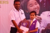 SOPBs-Plantation-Controller-Mr.-Selvarajah-Lurdusamy-handed-over-monetary-assistant-and-stationery-set-to-SAP-recipient.