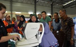 An elderly villager undergoes a visual acuity check during the eye-screening drive, run by the SOPB at Balingian Community Hall in Mukah.