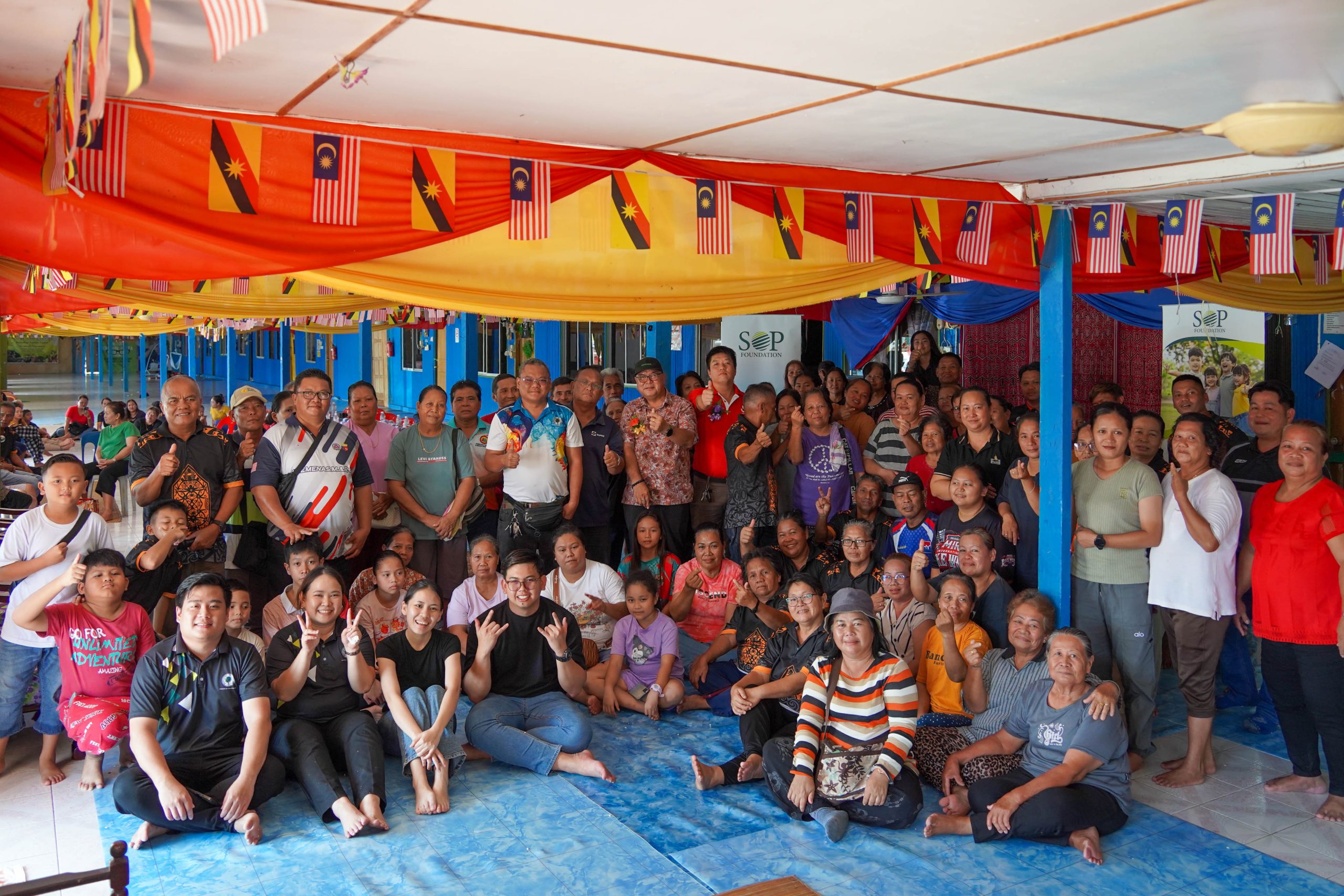 Group photo of residents and SOP Foundation reps after the spectacle’s handover.